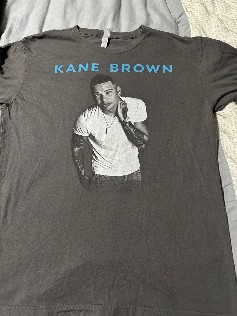 Next Level Apparel Black Tee with Blue Kane Brown Logo